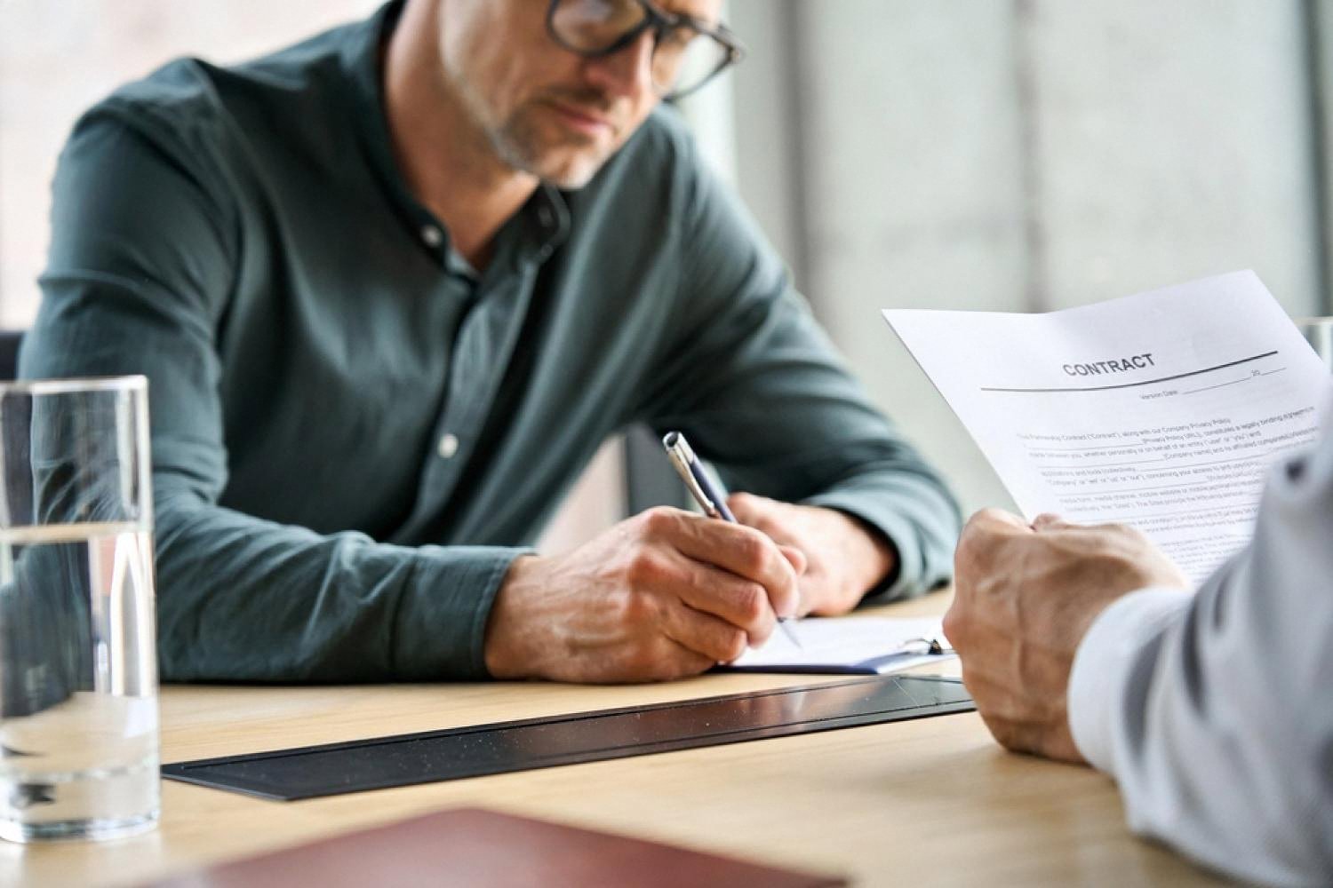 Candidate signing a job contract after passing psychometric assessment in the UAE